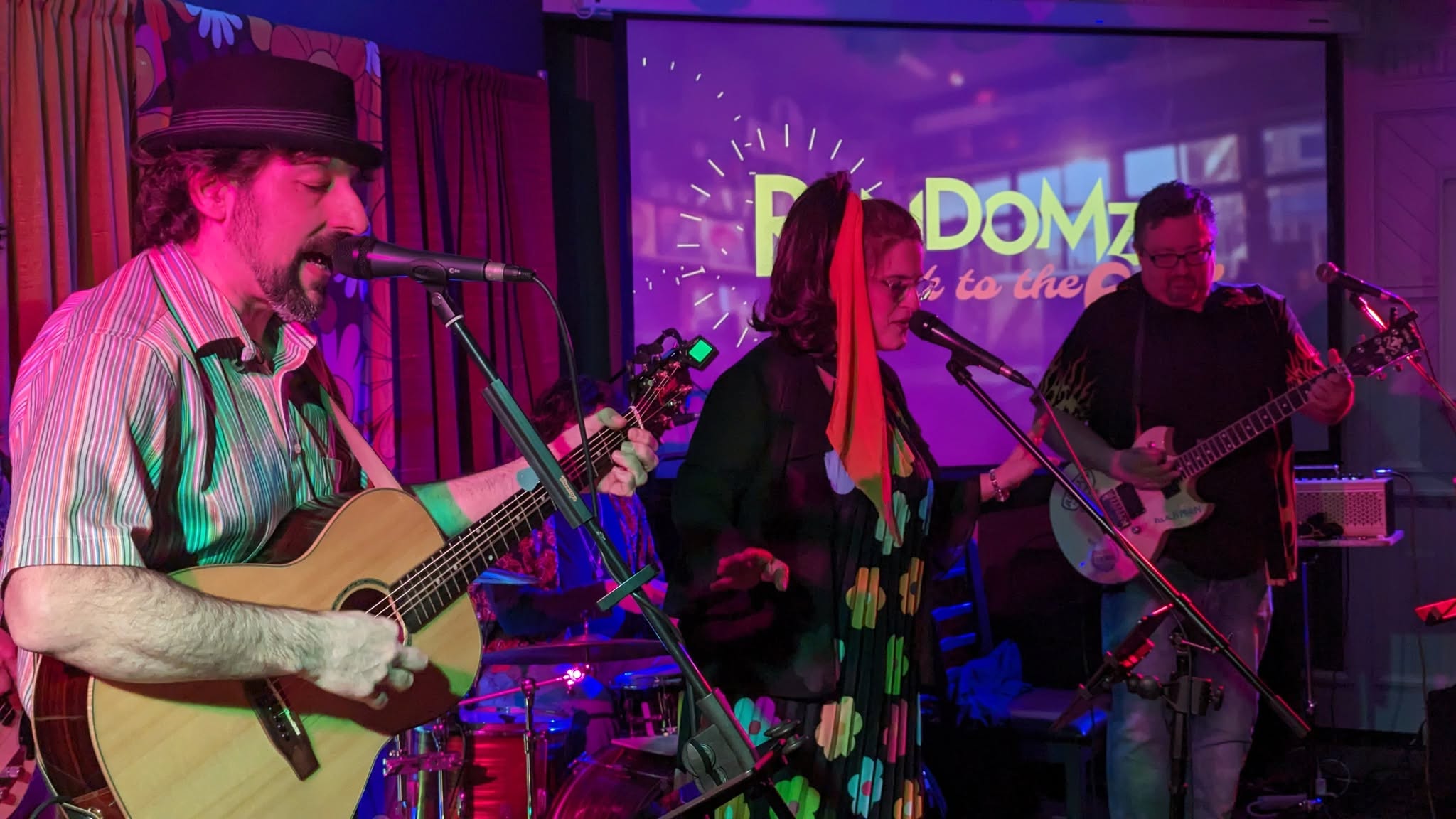 Acoustic guitarist performing with a live band