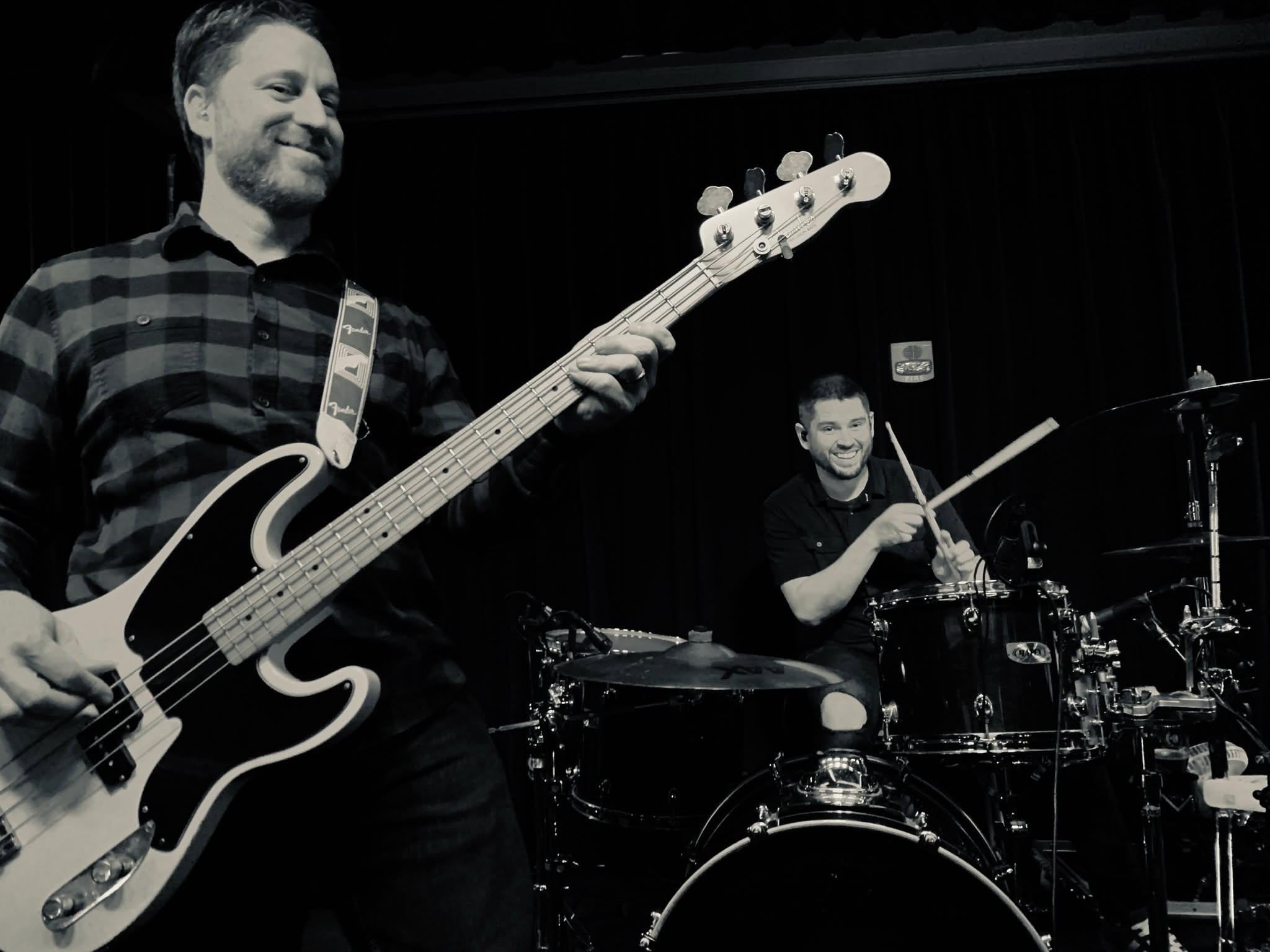 Bass player and drummer performing live in Moncton