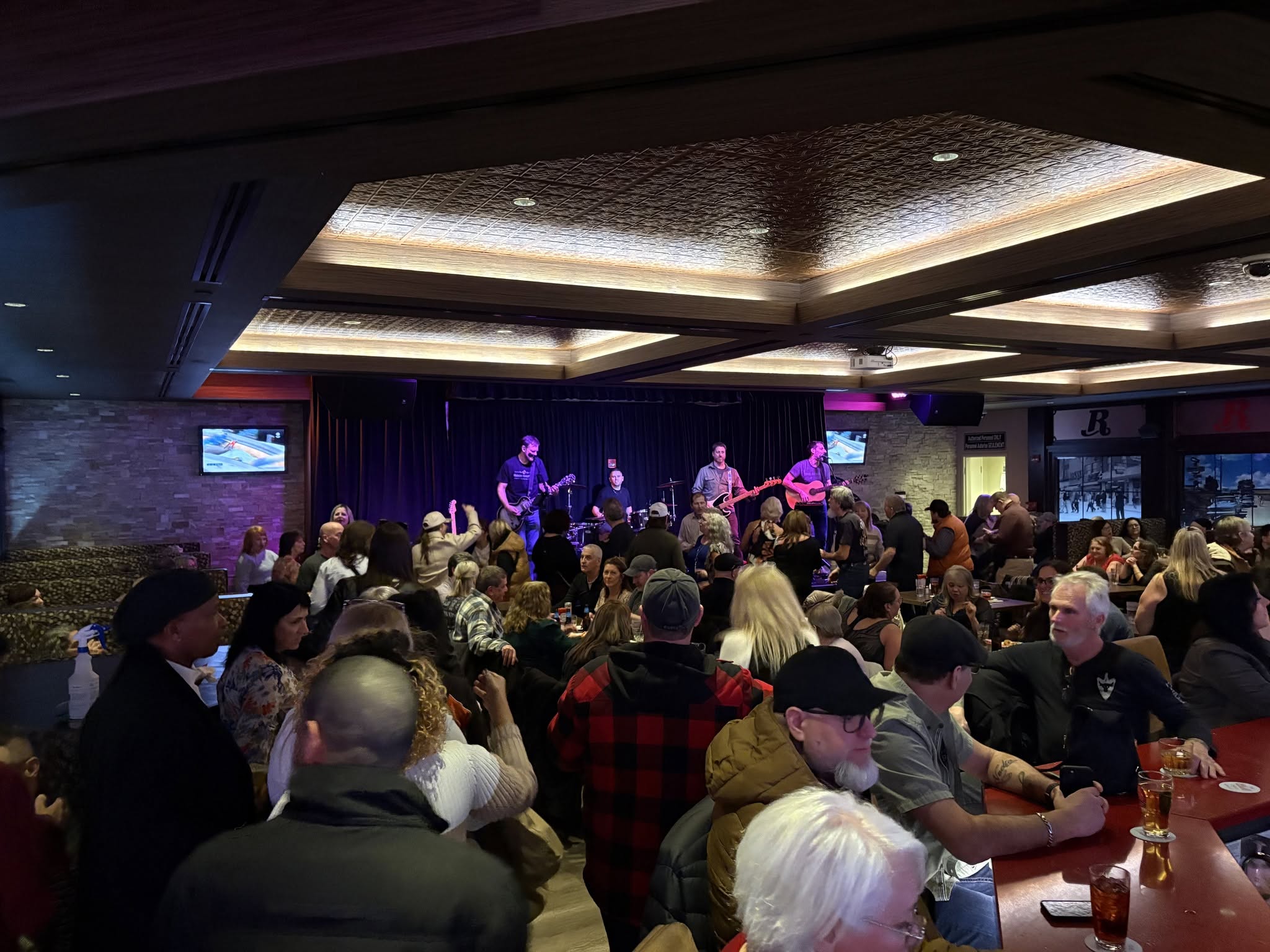 Large audience watching a live music event